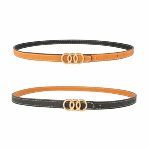 Reversible thin women belt with triple ring gold buckle, stylish black and camel leather design.