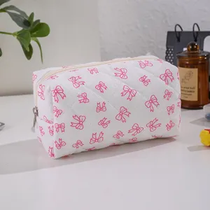 Cute pink bow quilted cosmetic bag, large capacity portable travel makeup storage pouch for women.