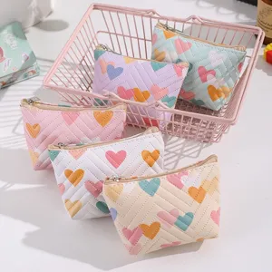 Cute heart quilted mini coin purse, portable leather zipper pouch detail for cosmetics.