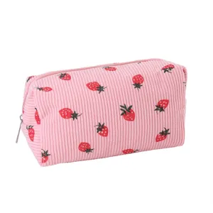 Pink corduroy cosmetic bag with cute strawberry print, portable zipper makeup pouch for women.