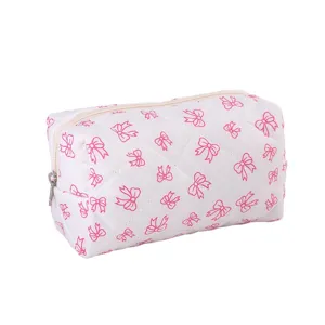 Detailed view of the cute pink bow quilted makeup bag, showing exquisite fabric and stitching.