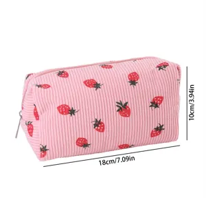 Pink corduroy makeup bag detail, cute strawberry pattern, portable size 18x10cm, zipper.