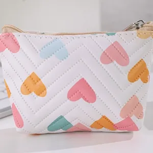 Cute leather coin purse with colorful heart pattern and quilted design, small portable card bag.