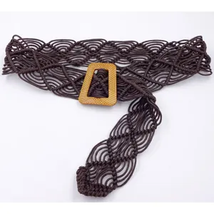 Close-up view of dark brown macrame woven belt with textured geometric buckle detail.