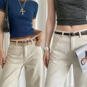 Stylish women's thin leather belt and jeans set, minimalist design with square silver buckle.