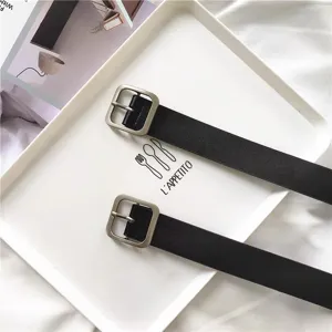 Minimalist black leather belt for women with square pin buckle. Versatile retro pants accessory for daily wear.