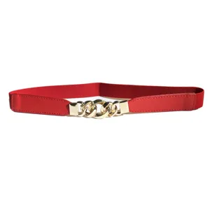 Close-up detail of the red elastic waist belt with a stylish gold chain metal buckle.
