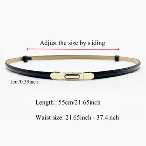 Close up of thin black glossy leather belt detail with gold spring buckle and measurements.