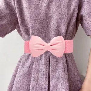 Detailed view of the pink elastic waist belt featuring a sweet large bow, perfect for dresses.