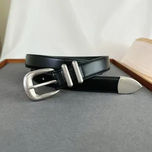 Detailed view of the black leather women belt featuring vintage silver metal buckles.