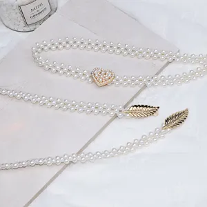 Pearl waist belt with heart and leaf metal buckles, elegant dress accessory for women.