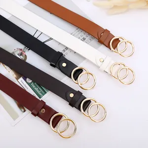 Detail shot of minimalist women PU leather belt with double gold round rings, multi-color.