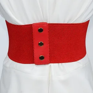 Red wide elastic waist belt detail showing stretch fabric and front snap button leather accent.
