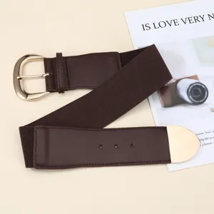 Detailed view of the dark brown women's wide elastic waist belt with a shiny gold metal buckle.