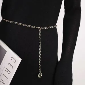 Detail shot of a stylish leather interwoven chain belt, elegant accessory for dress or sweater.