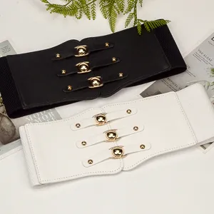 Wide elastic waist belt set with black and white options and gold snap buckles for dresses.