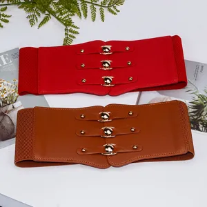 Detail view of women's wide elastic waist belt, vintage retro dress decorative cinch belt.