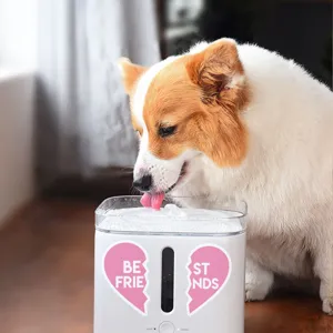 Detail shot of automatic pet water dispenser with cute pink heart sticker for pets.