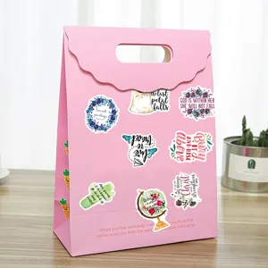Pink gift bag with inspirational English quote stickers, perfect for journaling and crafts.
