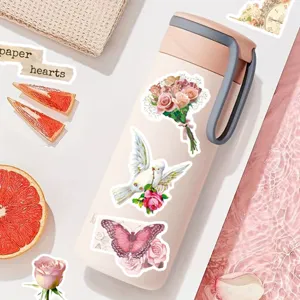 Pink vintage insulated water bottle with aesthetic floral butterfly stickers for daily use.