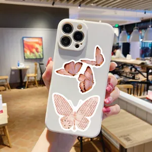 Vintage pink butterfly phone case with retro newspaper aesthetic design for daily phone protection.