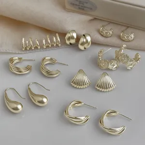 Gold geometric drop earrings set, elegant fashion jewelry for women daily commute style.