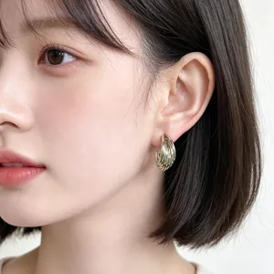 Exquisite coffee gold geometric teardrop earrings, elegant layered hoop design for modern women.