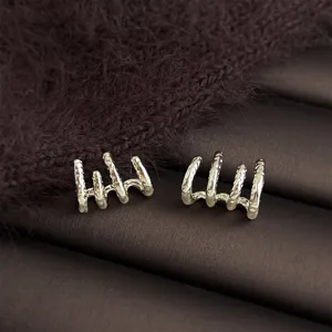 Coffee gold geometric multi-prong metal earrings detail showcase, elegant and stylish.