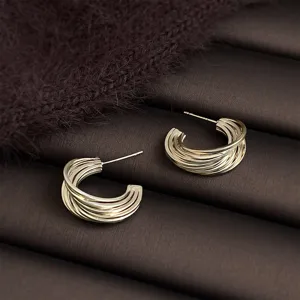 Elegant multi-layer hoop earrings in coffee gold, modern geometric smooth metal design.