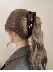 Elegant velvet bow banana hair clip, retro vertical claw clip for stylish ponytail updo.