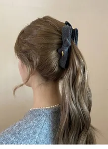 Grey bow hair claw clip for women elegant vintage ponytail holder chic hair accessory.