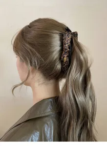 Leopard print bow banana hair clip detail view, elegant vertical hair claw for women styling.