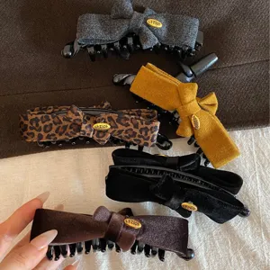 Vintage bow hair claw clip set, elegant velvet and tweed banana clips for women hairstyles.