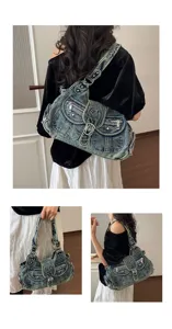 Vintage denim shoulder bag detail view, showing multiple pockets and casual crossbody style design.