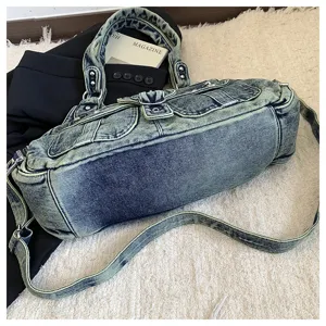 Vintage washed denim shoulder bag for women, multi-pocket casual crossbody hobo bag with top handles.