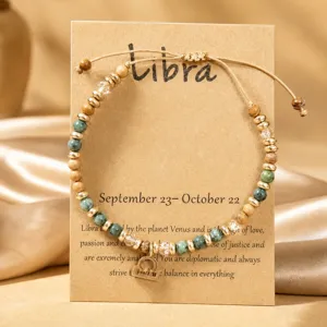 Vue détaillée du bracelet de perles en pierre naturelle Libra sur carte avec infos du zodiaque.