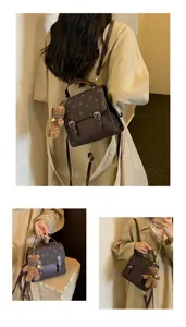 Detailed view of women's fashion backpack with heart pattern and cute teddy bear pendant.