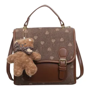 Brown vintage canvas and leather backpack for women, cute teddy bear pendant, casual school bag