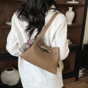 Stylish brown leather shoulder bag for women, chic casual crossbody bag with metal lock.