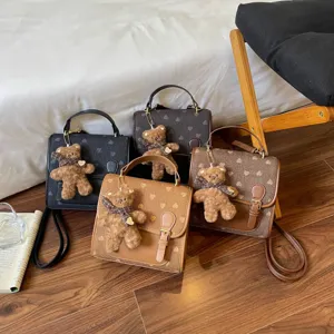 Fashion contrast mini backpack for women, trendy cute design with plush bear charm, casual daily bag.