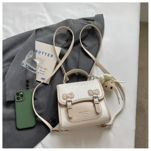 Mochila pequeña beige trenzada para mujer, bolso estilo colegial retro con bonito lazo.