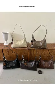 Minimalist autumn dumpling shoulder bag for women, chic commuting hobo crossbody bag style.