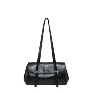 Stylish black PU leather shoulder bag for women, chic commuting underarm bag with double straps.