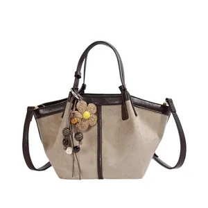 Detailed view of the contrast color bucket bag, featuring textured suede and smooth trim.
