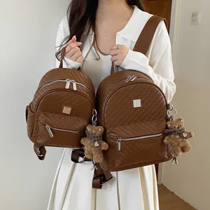 Women's brown woven backpack retro casual college style book bag with cute bear pendant.