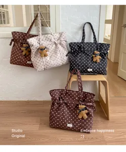 Casual polka dot tote bag for women, large capacity canvas shoulder bag with cute bear pendant.