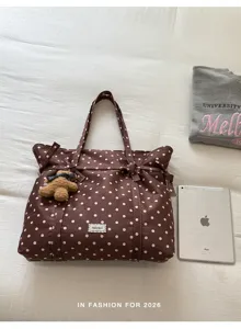 Brown polka dot canvas tote bag detail view, casual large capacity shoulder bag with bow.