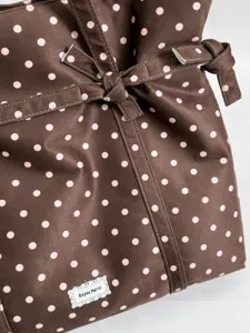 Brown polka dot shoulder tote bag with cute bow detail, casual commuter handbag for women.