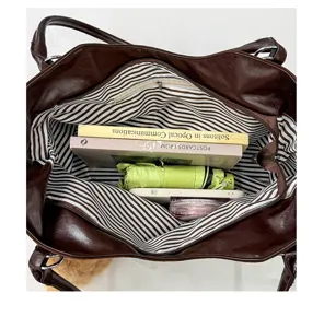 Large capacity brown PU leather tote bag interior view, showing spacious commuting handbag design.