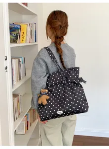 Stylish polka dot tote bag with bow detail and cute bear pendant for women daily commute.
